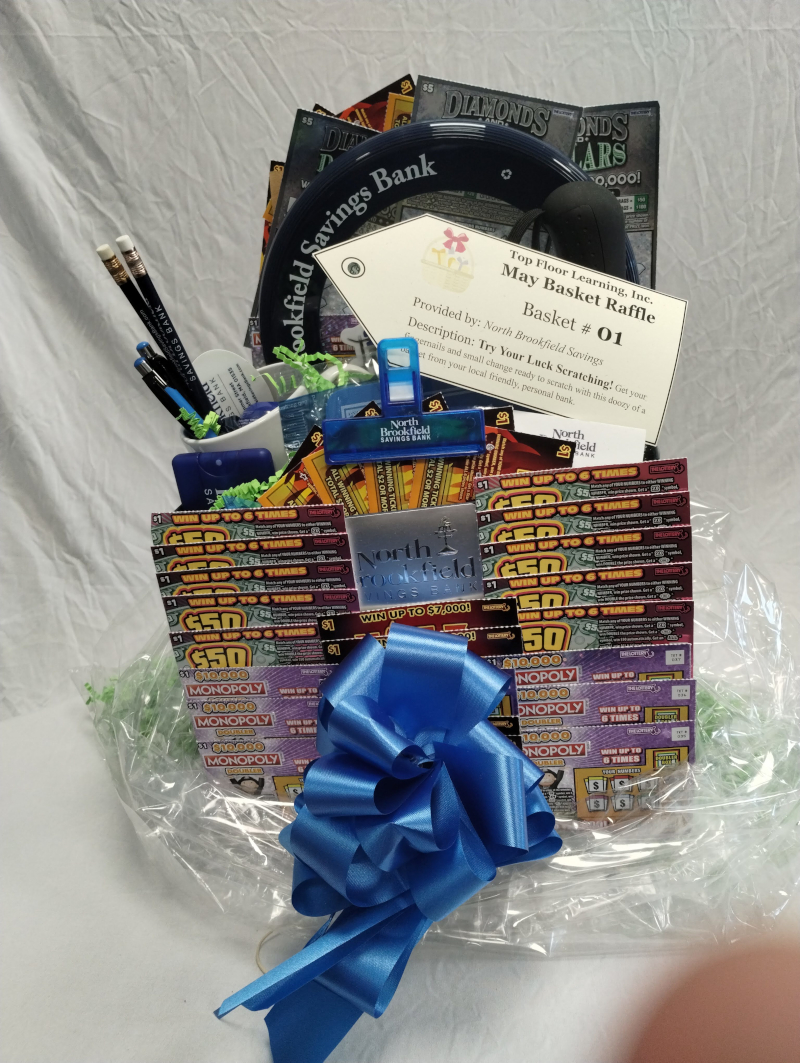 picture of a basket with many scratch lottery tickets as well as North Brookfield Savings Bank swag including pens, mug, umbrella, etc.