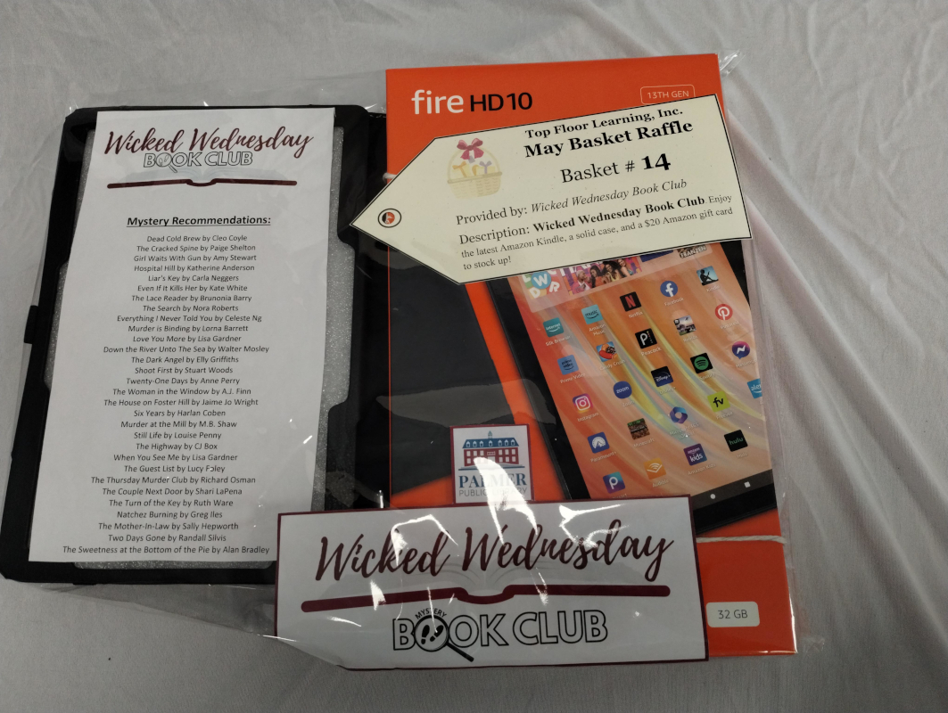 photo of an Amazon kindle with case, and a printed list of book recommendations 