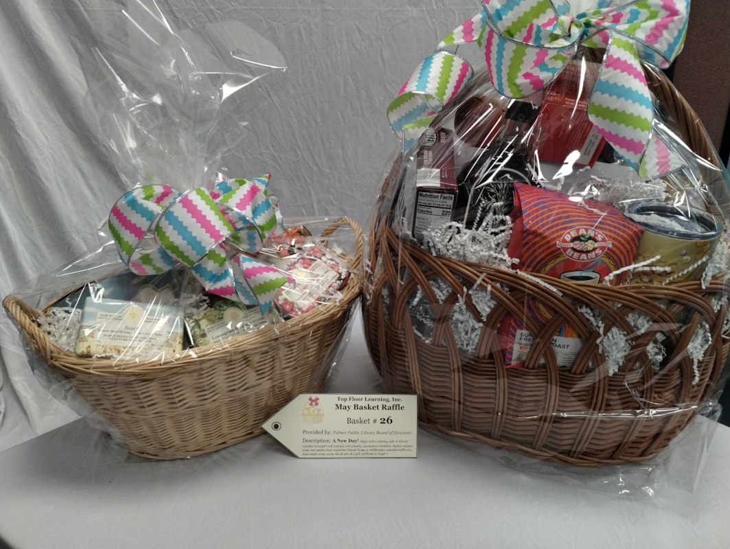 photo of two wicker baskets stuffed full. one has soaps and candles, while the other is full of breakfast goodies including a wafflemaker, mixes, jams, and maple syrup