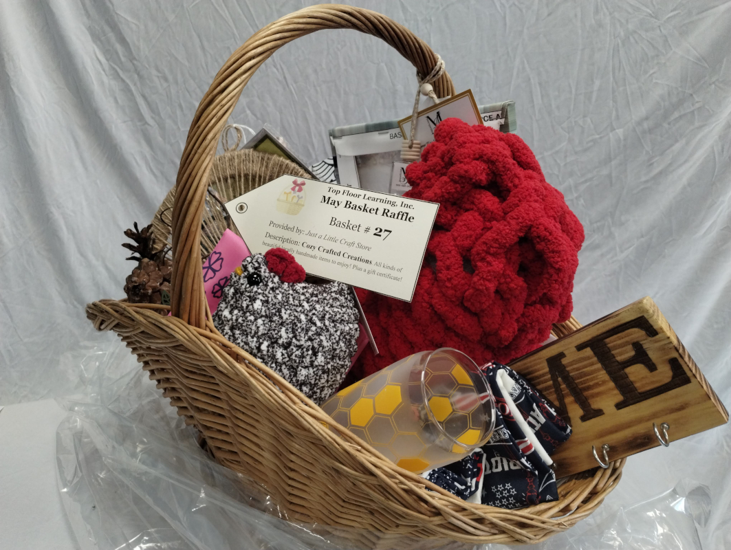 a large basket stuffed full of handcrafted items. 