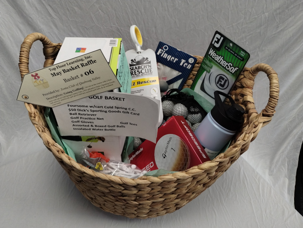 photograph of a large basket full of golfing equipment